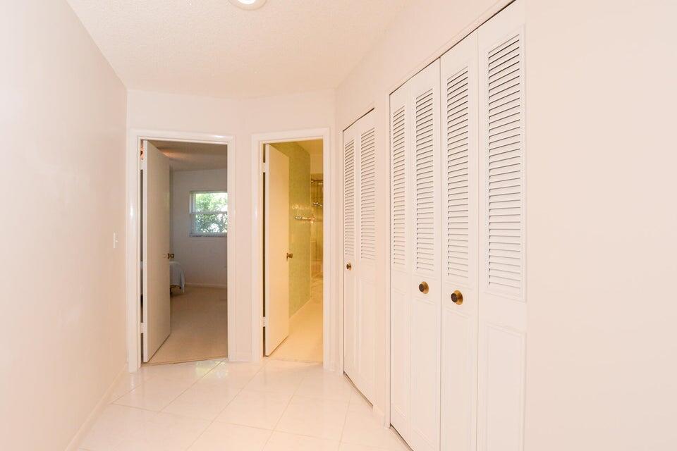 1117 Southeast Mendoza Avenue Port St. Lucie, FL 34952 - Photo 16 of 24 a view of cabinet with mirror