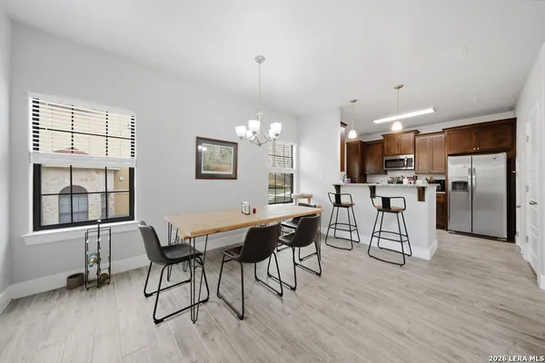 a view of a dining room with furniture window and wooden floor