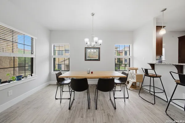 a view of a dining room with furniture window and outside view