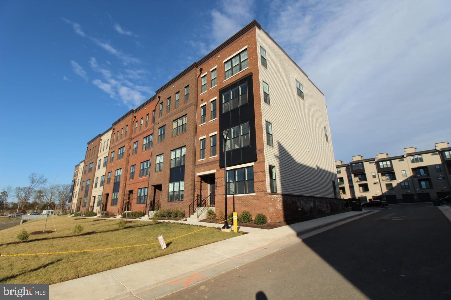 22383 Roanoke Rise Terrace Ashburn, VA 20148 - Photo 1 of 41 a view of a tall building next to a road