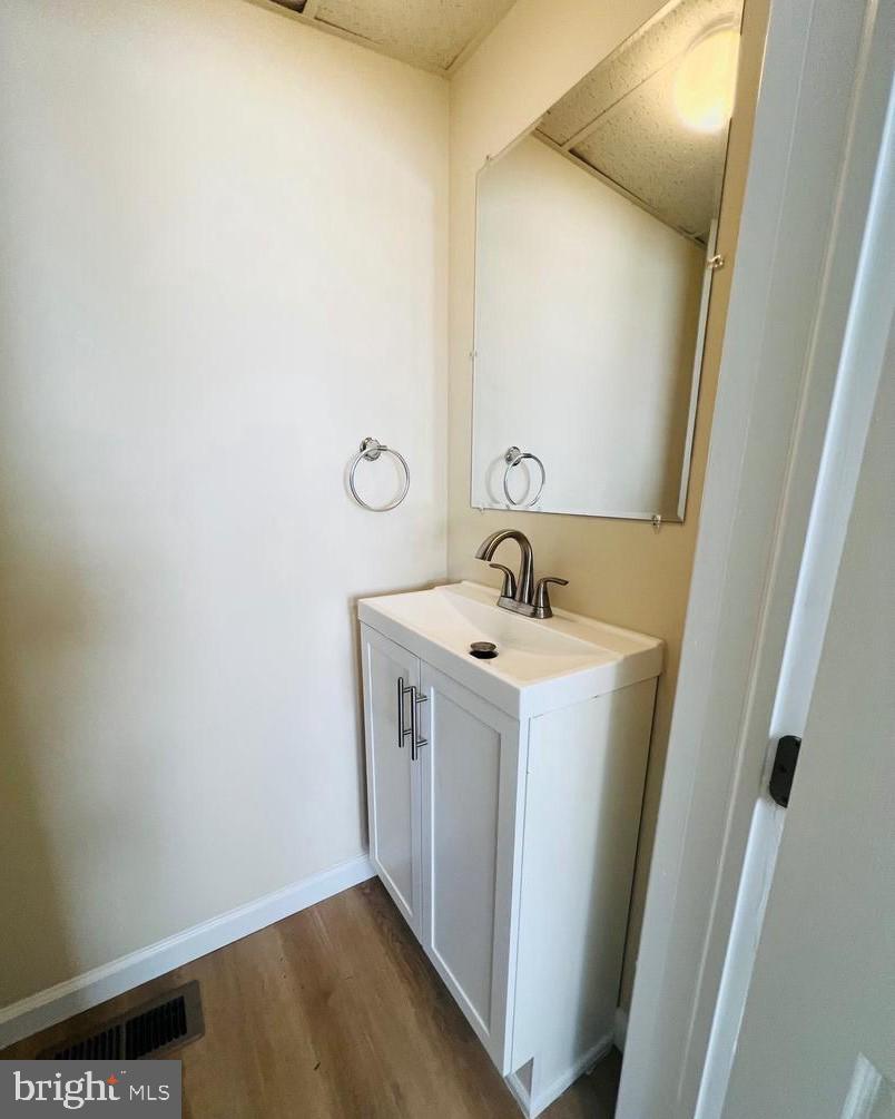 617 3rd Street Beverly, NJ 08010 - Photo 15 of 16 a utility room with sink and mirror