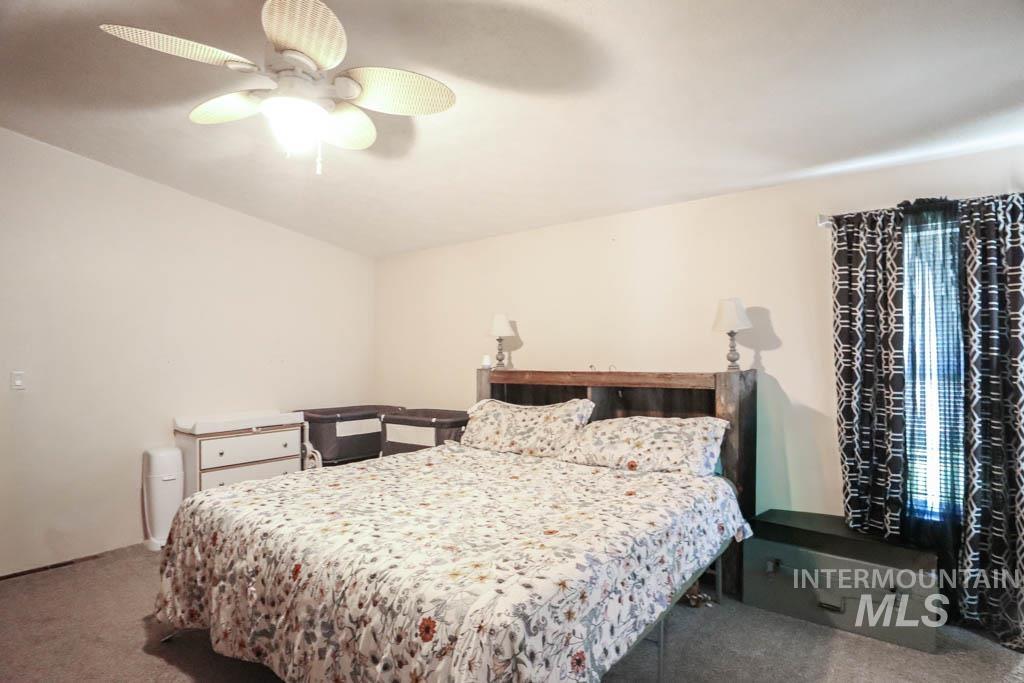 815 Eaton Road Weiser, ID 83672 - Photo 32 of 50 Carpeted bedroom with a ceiling fan