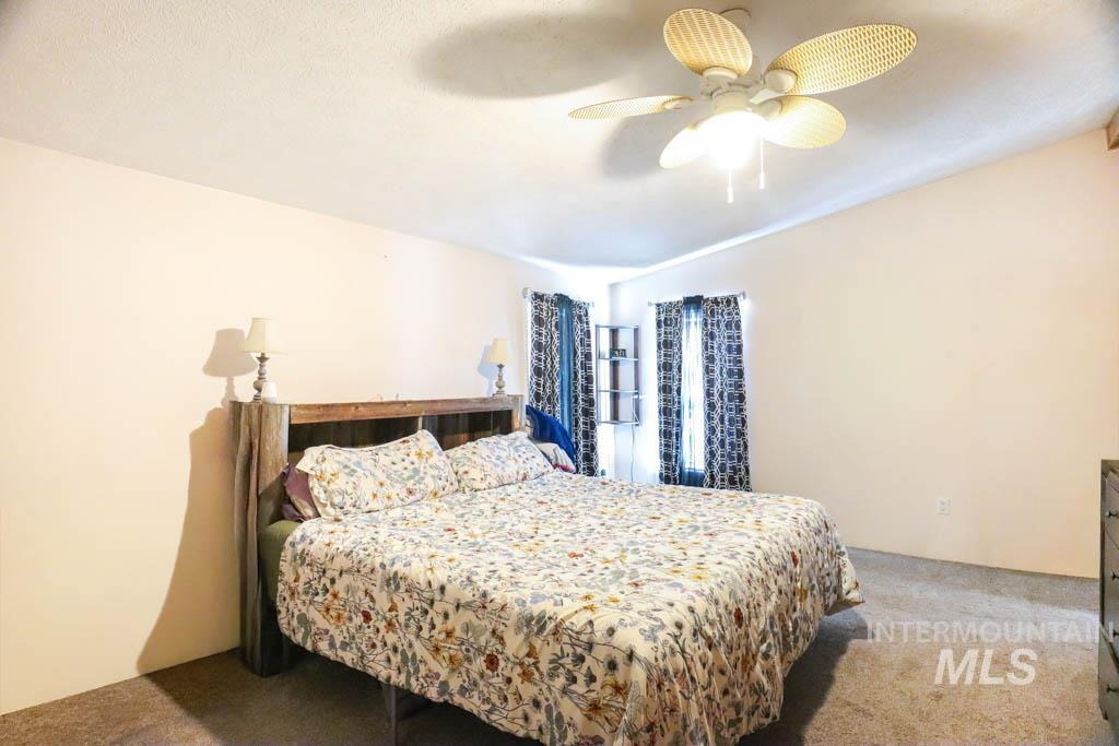 815 Eaton Road Weiser, ID 83672 - Photo 33 of 50 Carpeted bedroom with ceiling fan