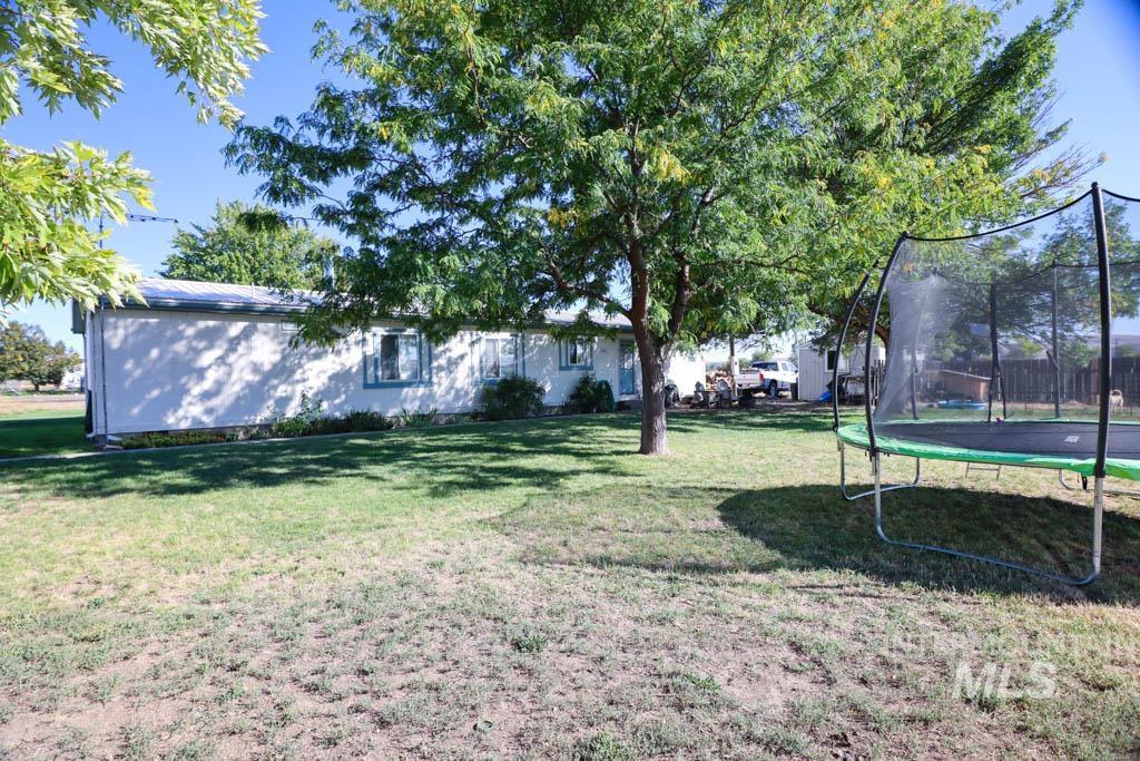 815 Eaton Road Weiser, ID 83672 - Photo 39 of 50 View of grassy yard with a trampoline