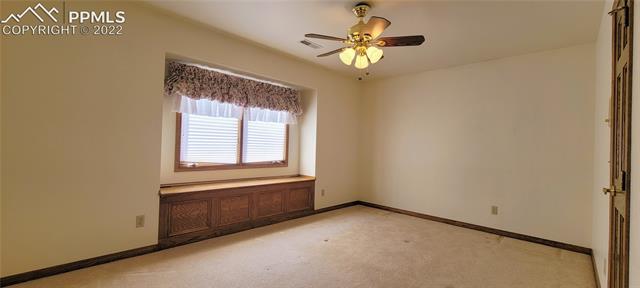 731 Winding Hills Road Monument, CO 80132 - Photo 6 of 9 Upstairs bedroom with built-in bench / storage.