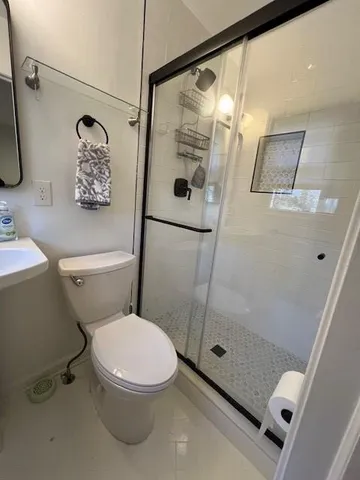 a bathroom with a sink and a shower curtain