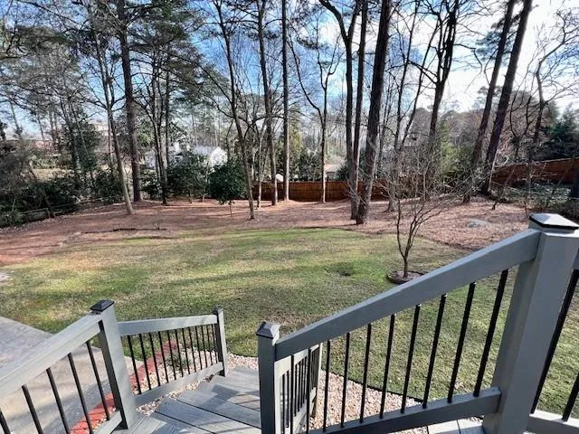 a view of a porch with furniture and floor to ceiling window