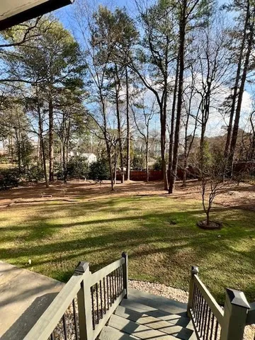 a view of a backyard with sitting area