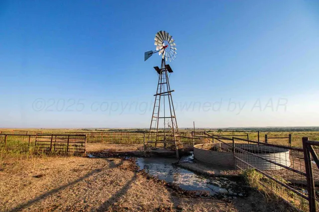 a view of a wooden house with a yard