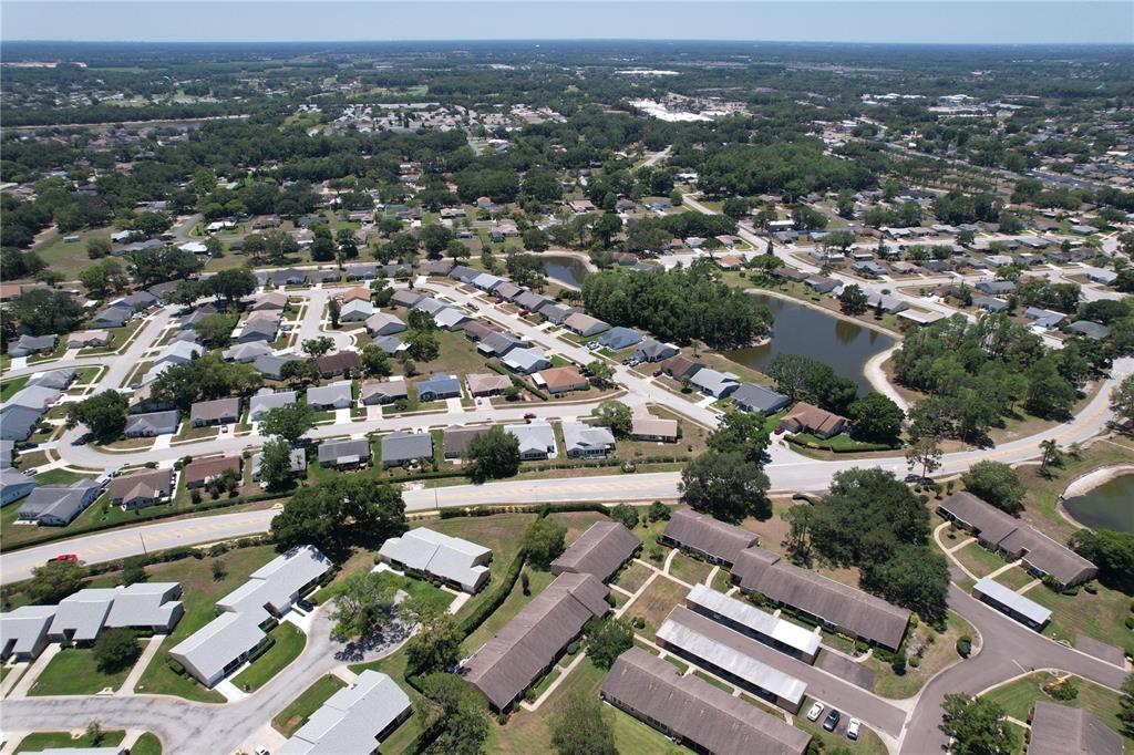 9319 Trowbridge Court New Port Richey, FL 34655 - Photo 69 of 78 an aerial view of residential houses with city view