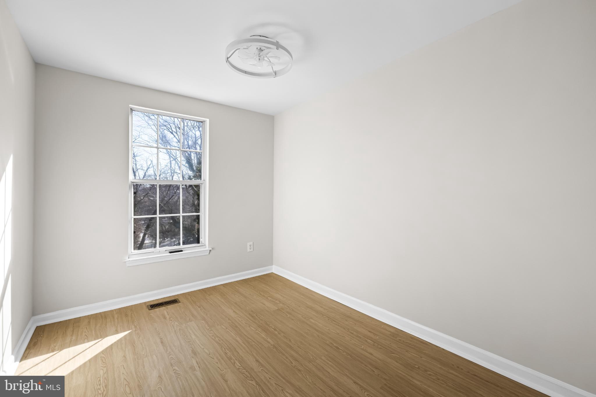 925 Pirates Court Edgewood, MD 21040 - Photo 15 of 29 an empty room with wooden floor and windows
