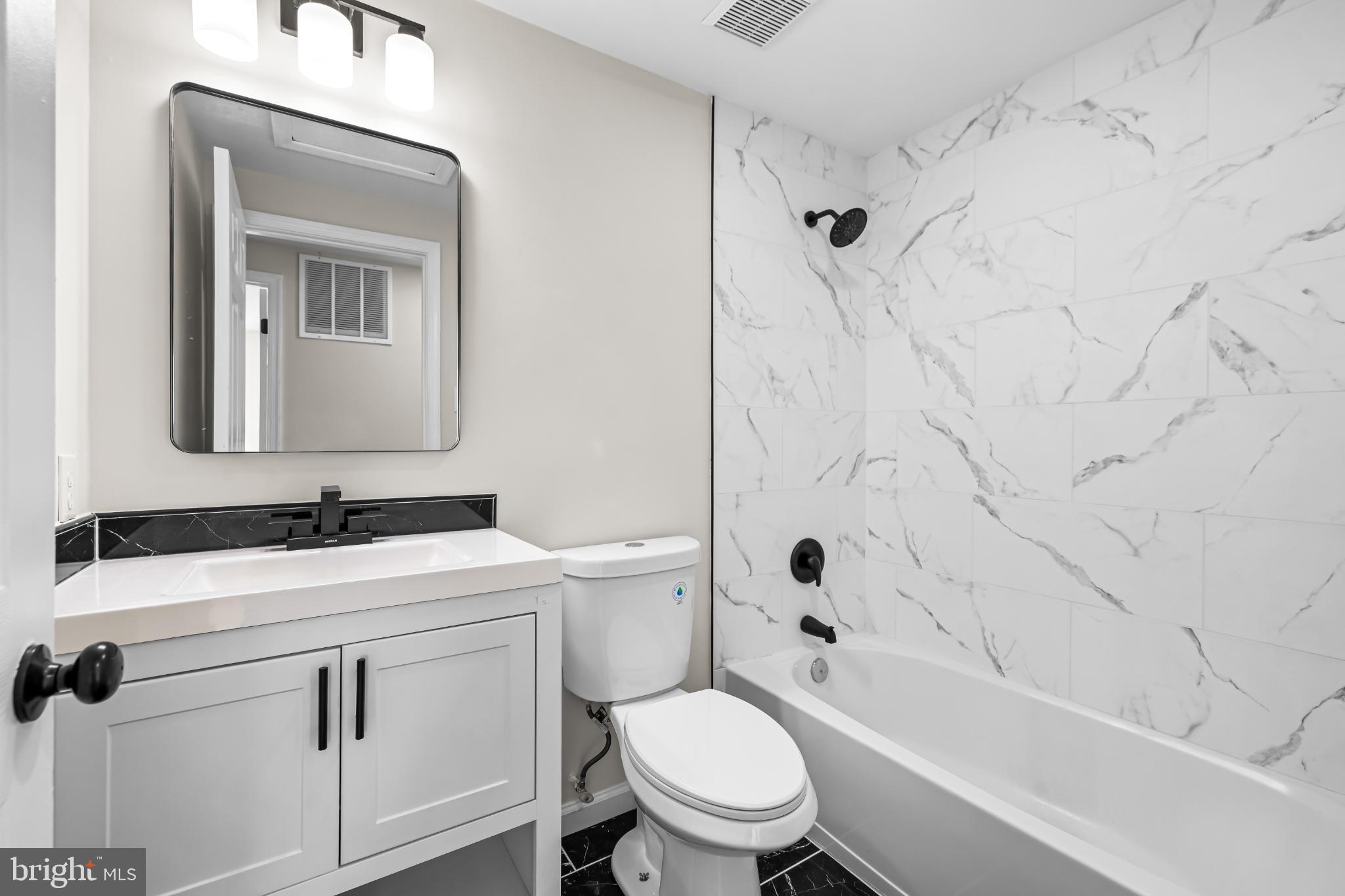 925 Pirates Court Edgewood, MD 21040 - Photo 17 of 29 a bathroom with a sink toilet and shower
