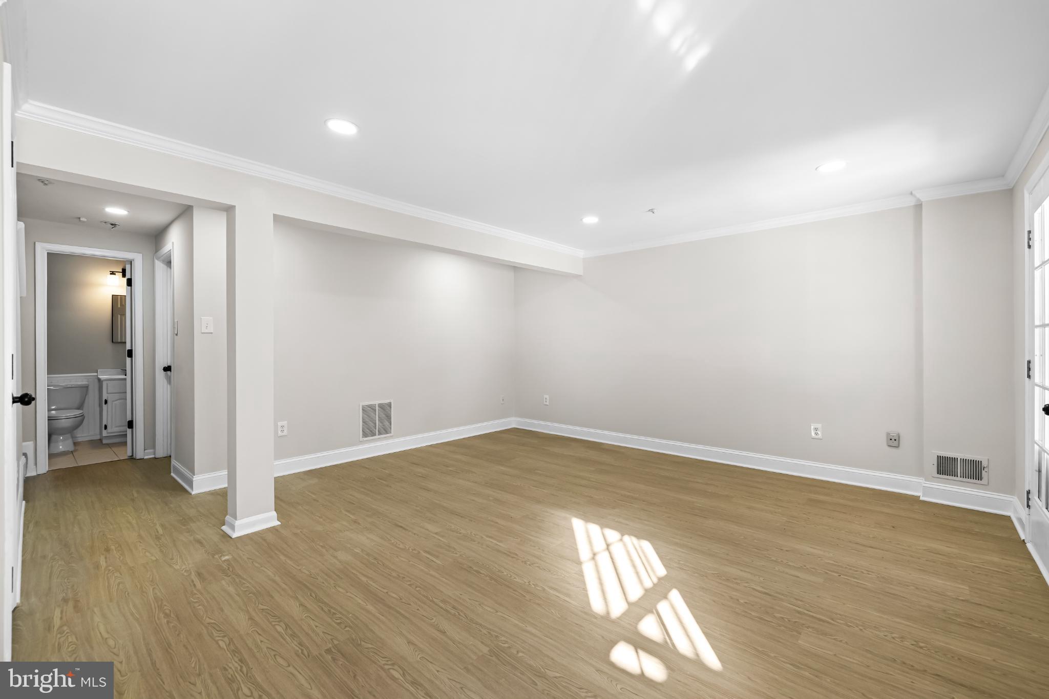 925 Pirates Court Edgewood, MD 21040 - Photo 20 of 29 an empty room with wooden floor and windows