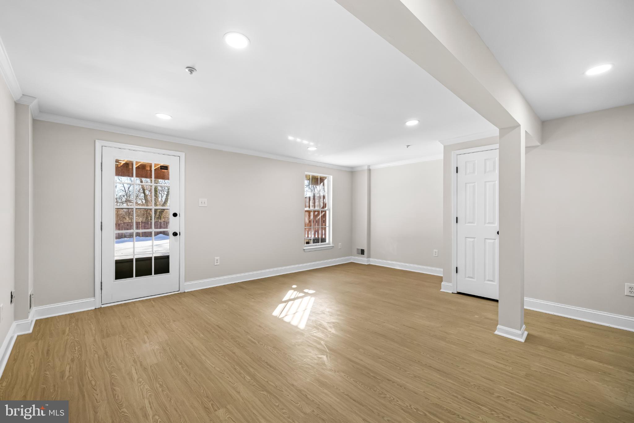 925 Pirates Court Edgewood, MD 21040 - Photo 22 of 29 an empty room with wooden floor and windows