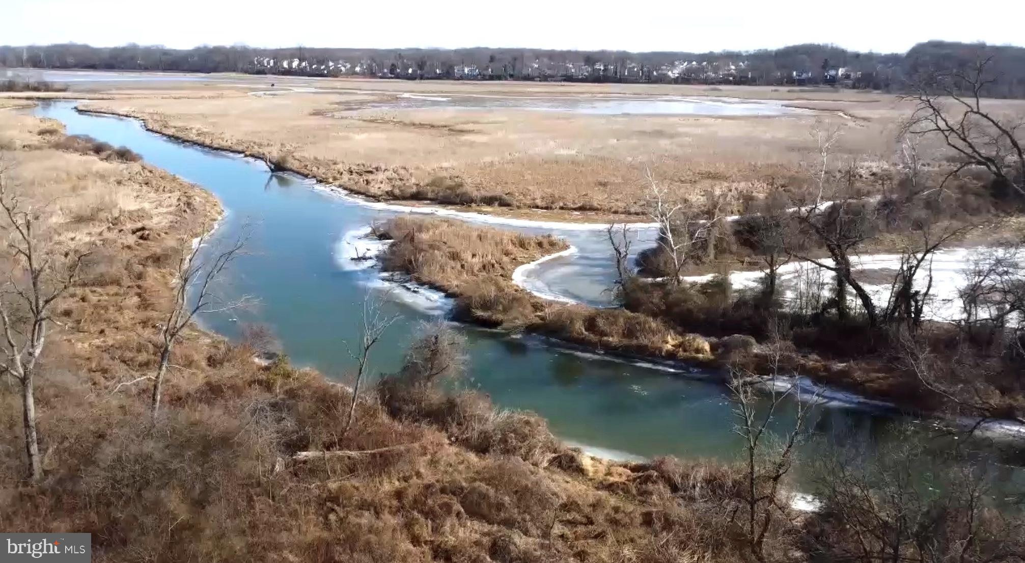 925 Pirates Court Edgewood, MD 21040 - Photo 3 of 3 Serene river winding through winter landscape.