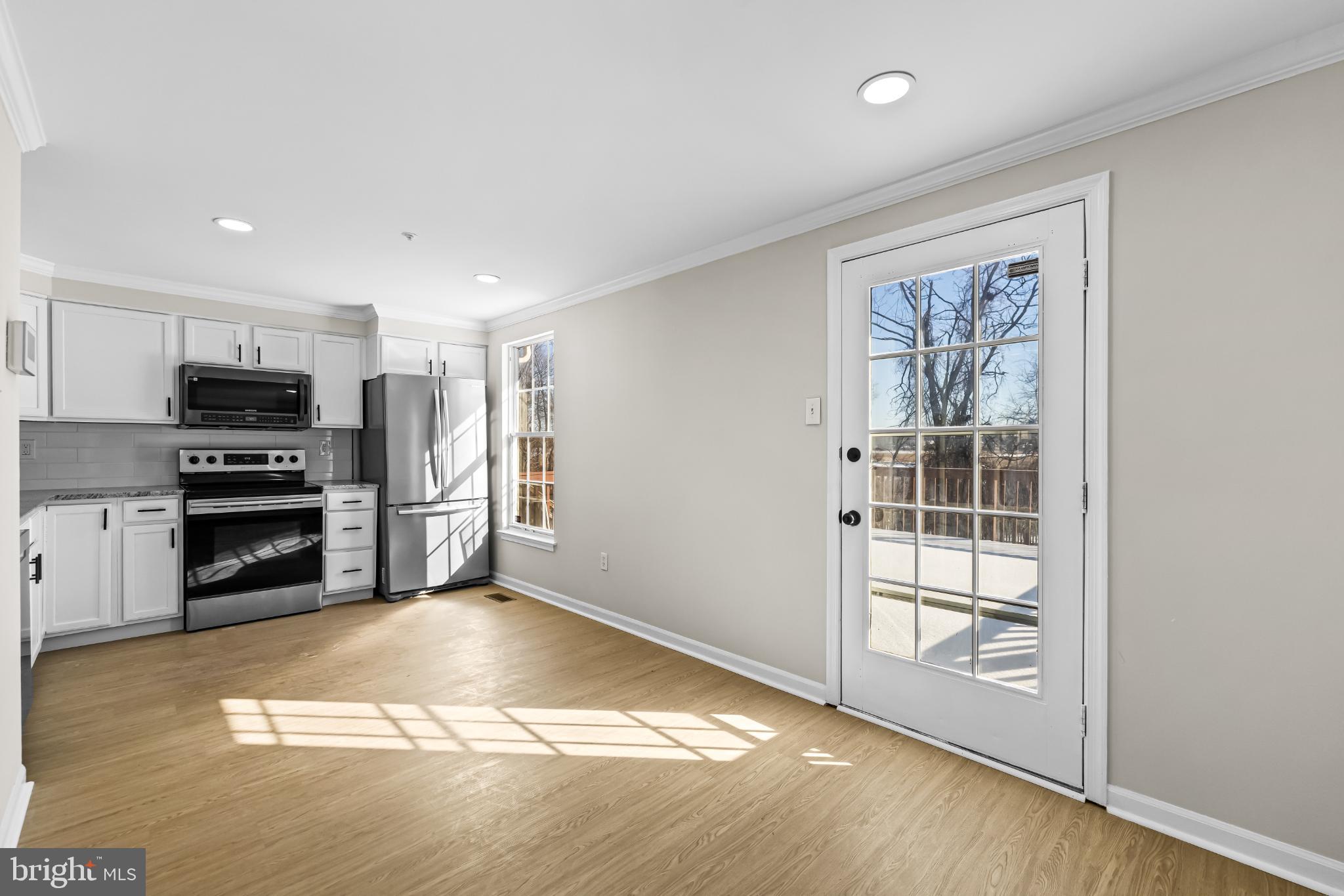 925 Pirates Court Edgewood, MD 21040 - Photo 8 of 29 a view of kitchen with refrigerator stove and wooden floor