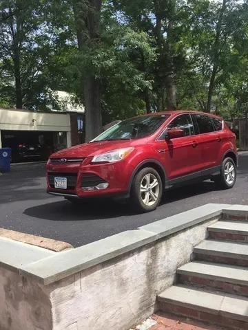 a front view of a house with parking space