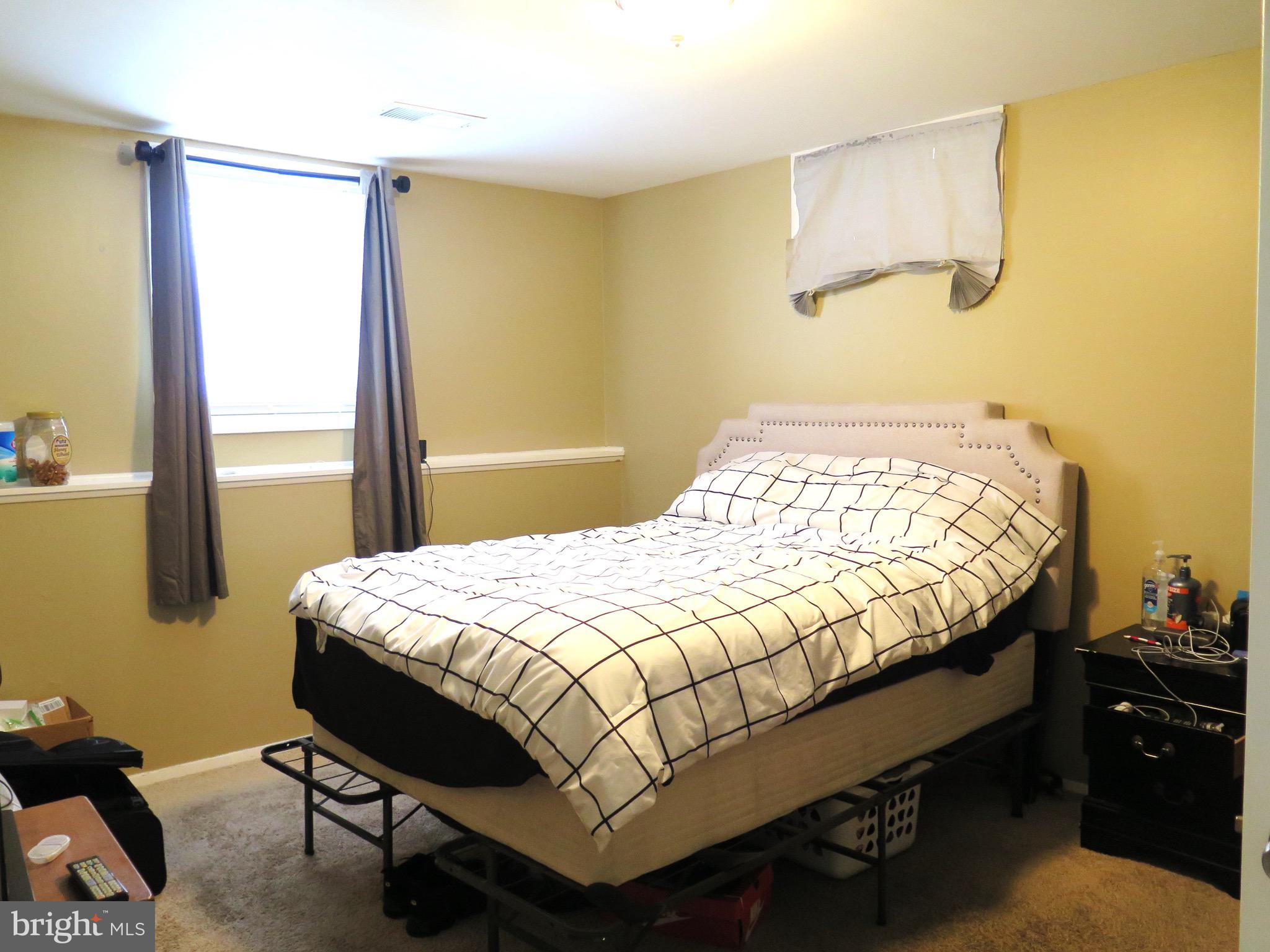 3939 Nemo Road Randallstown, MD 21133 - Photo 16 of 31 a bedroom with a bed and a window