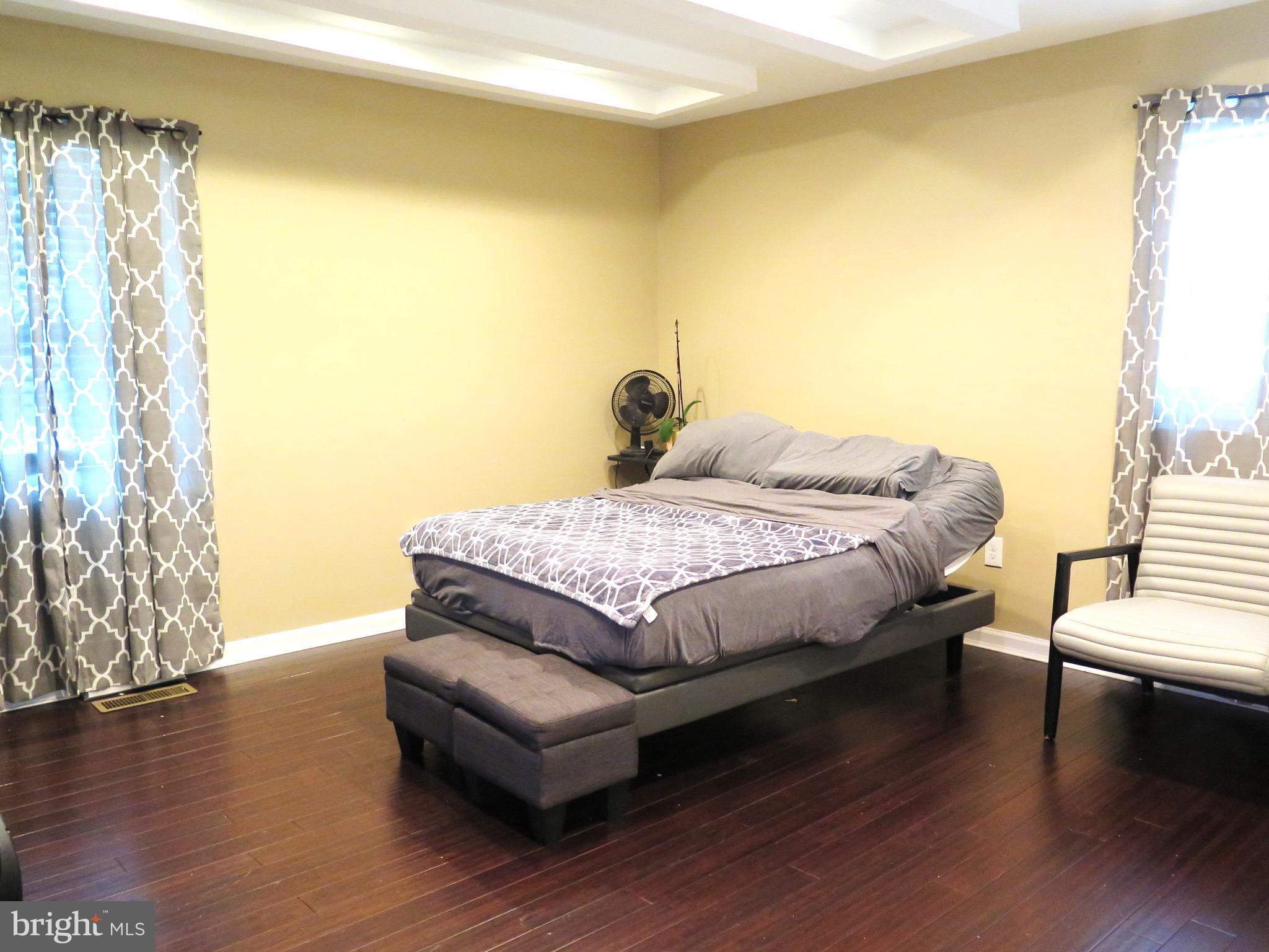 3939 Nemo Road Randallstown, MD 21133 - Photo 19 of 31 a bedroom with a bed and wooden floor