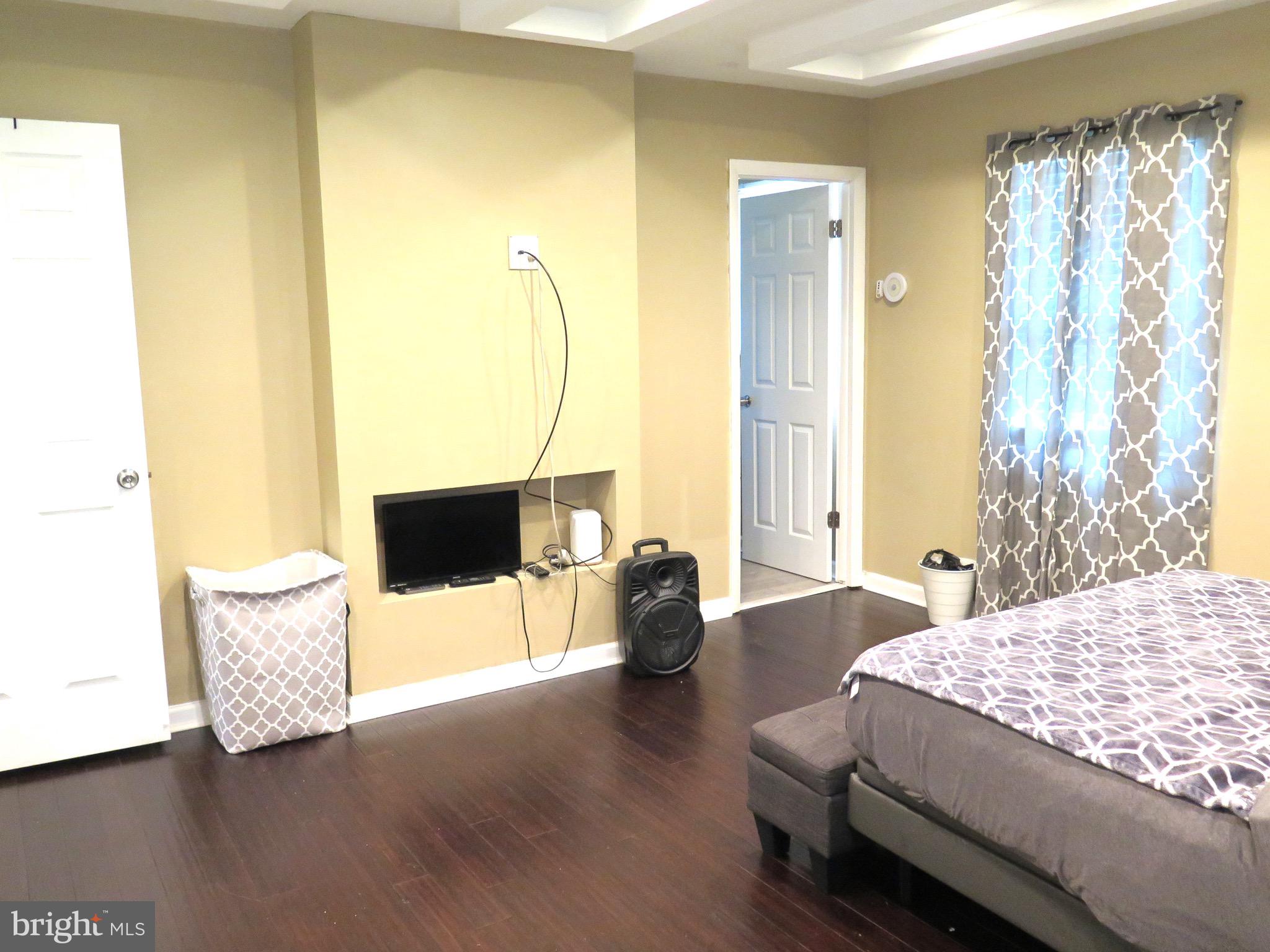 3939 Nemo Road Randallstown, MD 21133 - Photo 20 of 31 a bedroom with a bed and wooden floor