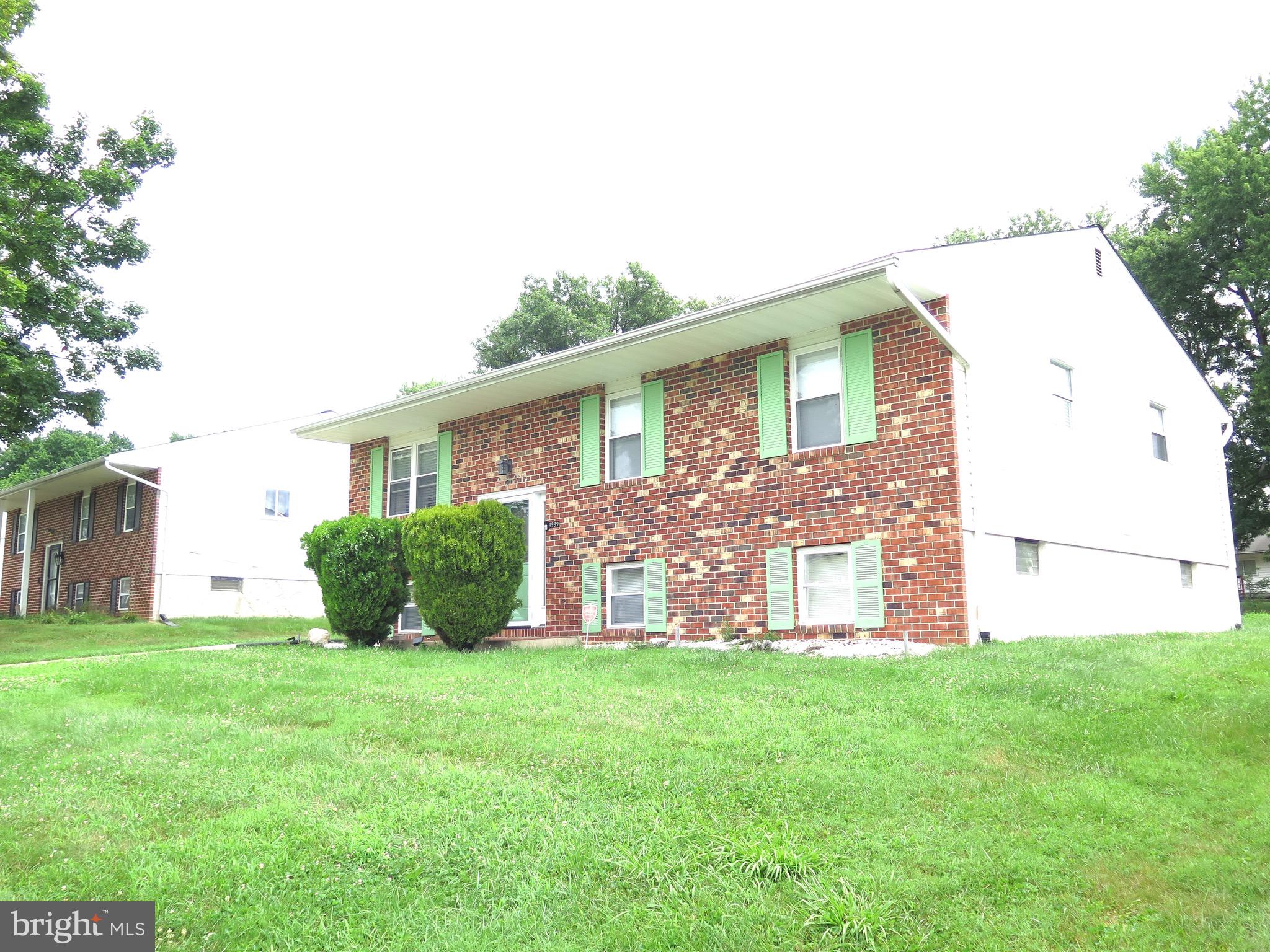 3939 Nemo Road Randallstown, MD 21133 - Photo 23 of 31 a front view of a house with a garden and yard