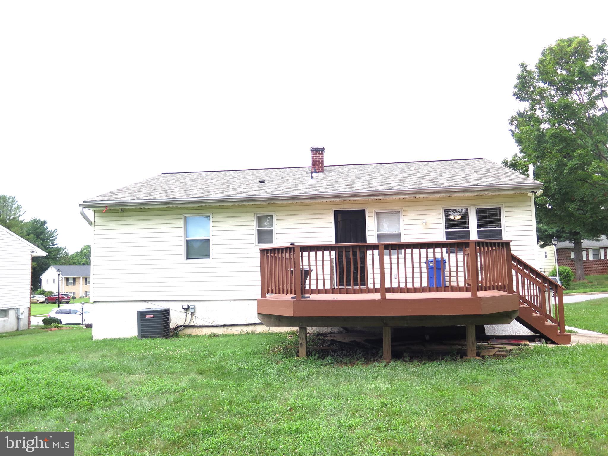3939 Nemo Road Randallstown, MD 21133 - Photo 28 of 31 a backyard of a house with wooden deck and barbeque oven