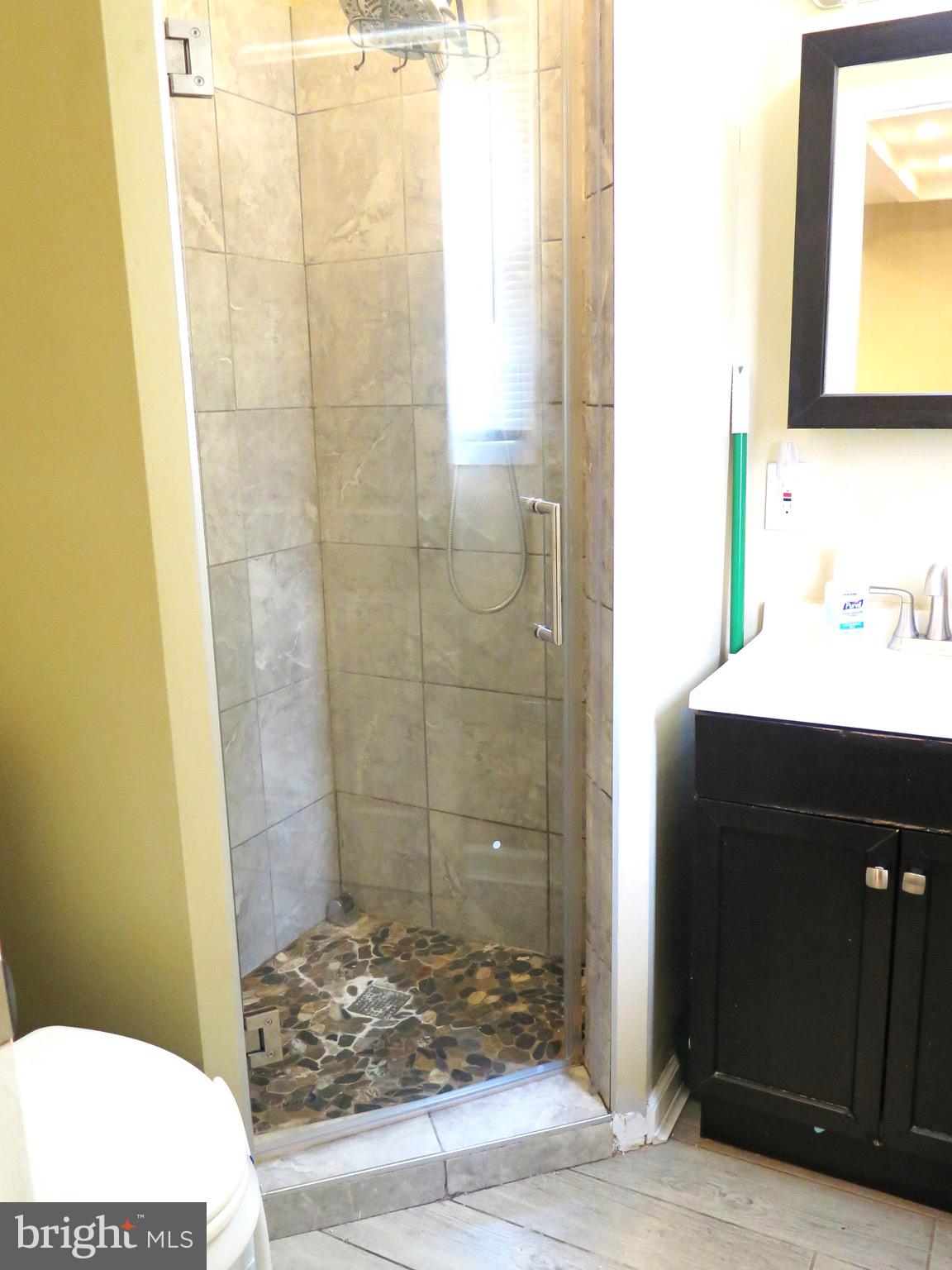 3939 Nemo Road Randallstown, MD 21133 - Photo 31 of 31 a bathroom with a sink and a mirror