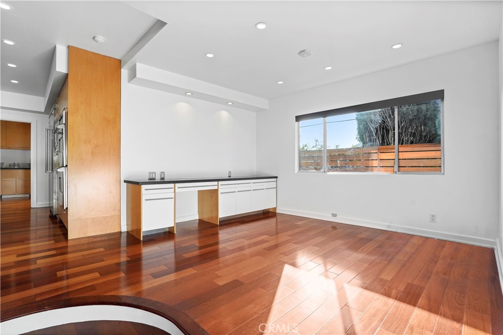 16301 Meadow Ridge Road West Encino, CA 91436 - Photo 18 of 33 a view of empty room with wooden floor and fan