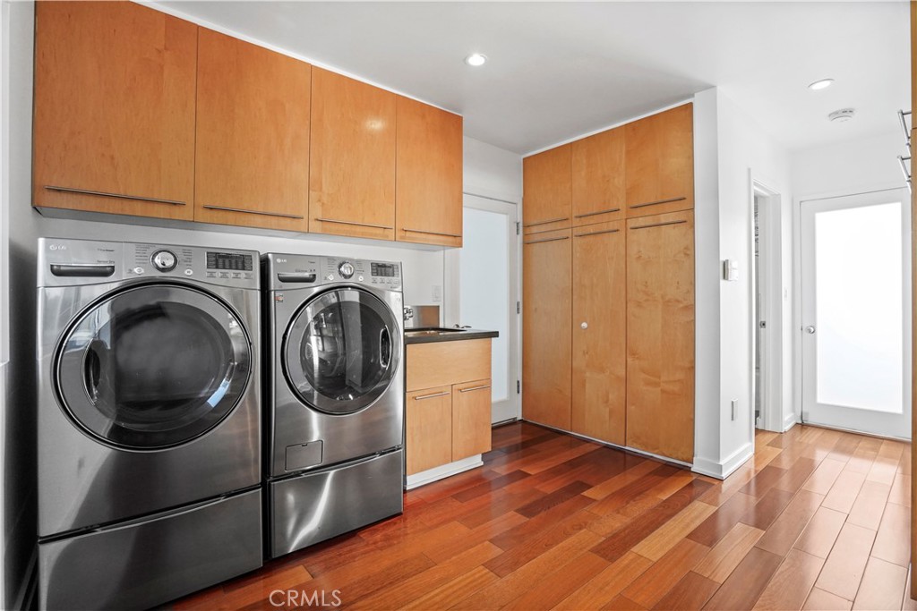 16301 Meadow Ridge Road West Encino, CA 91436 - Photo 20 of 33 a view of a kitchen with washer and dryer
