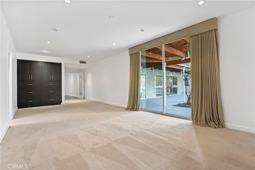 16301 Meadow Ridge Road West Encino, CA 91436 - Photo 21 of 33 a view of an empty room with a window