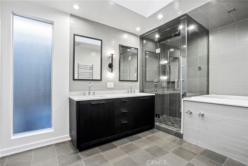 16301 Meadow Ridge Road West Encino, CA 91436 - Photo 22 of 33 a bathroom with a sink double vanity and a mirror