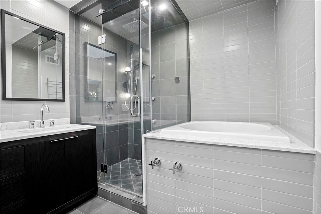 16301 Meadow Ridge Road West Encino, CA 91436 - Photo 24 of 33 a bathroom with a sink a toilet and shower