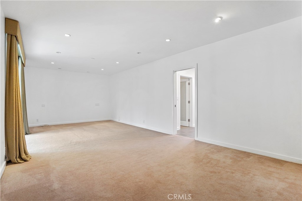 16301 Meadow Ridge Road West Encino, CA 91436 - Photo 28 of 33 an empty room with a empty space and windows