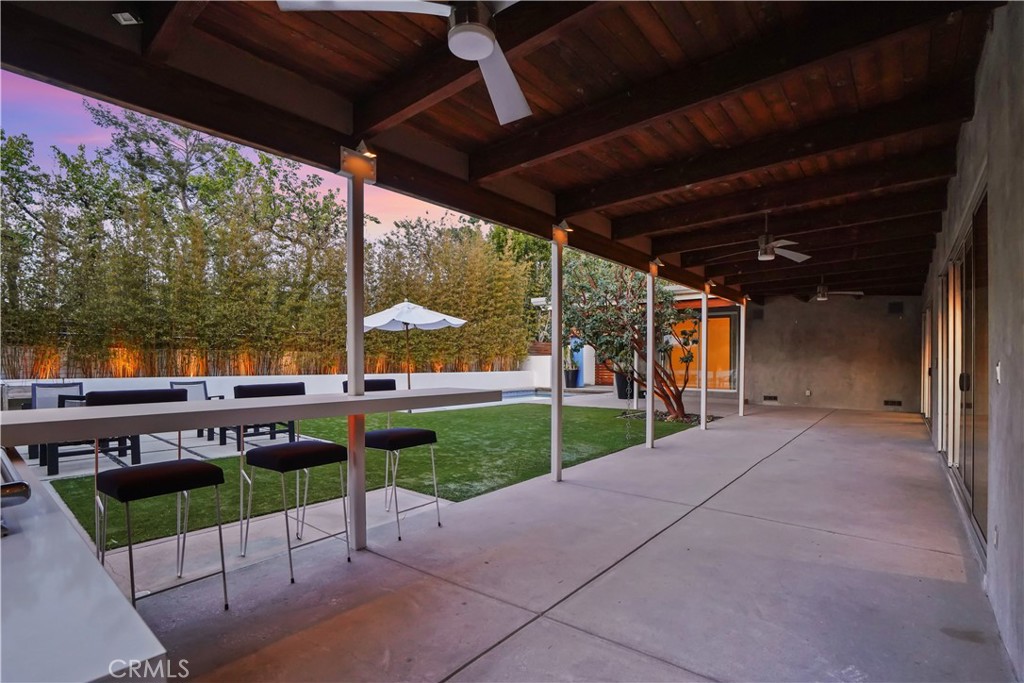 16301 Meadow Ridge Road West Encino, CA 91436 - Photo 30 of 33 a view of a porch with furniture and garden