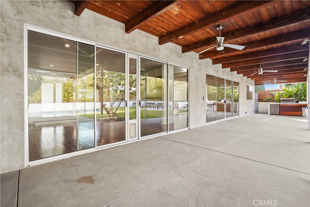 16301 Meadow Ridge Road West Encino, CA 91436 - Photo 31 of 33 a view of an empty room with wooden floor and windows