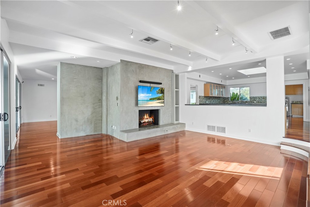 16301 Meadow Ridge Road West Encino, CA 91436 - Photo 5 of 33 a view of an empty room with window and wooden floor