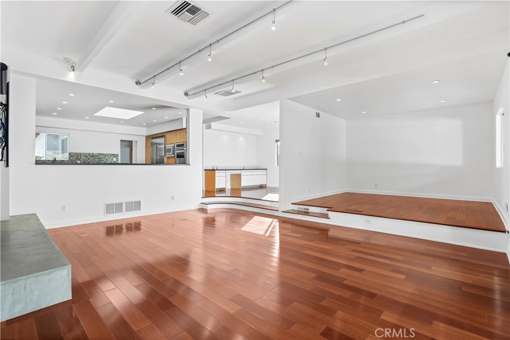 16301 Meadow Ridge Road West Encino, CA 91436 - Photo 7 of 33 a view of a livingroom with wooden floor