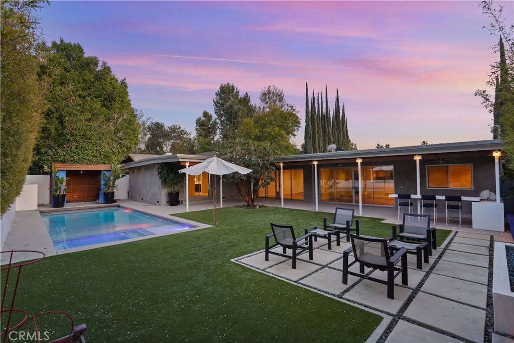 16301 Meadow Ridge Road West Encino, CA 91436 - Photo 8 of 33 a view of a house with a yard and sitting area