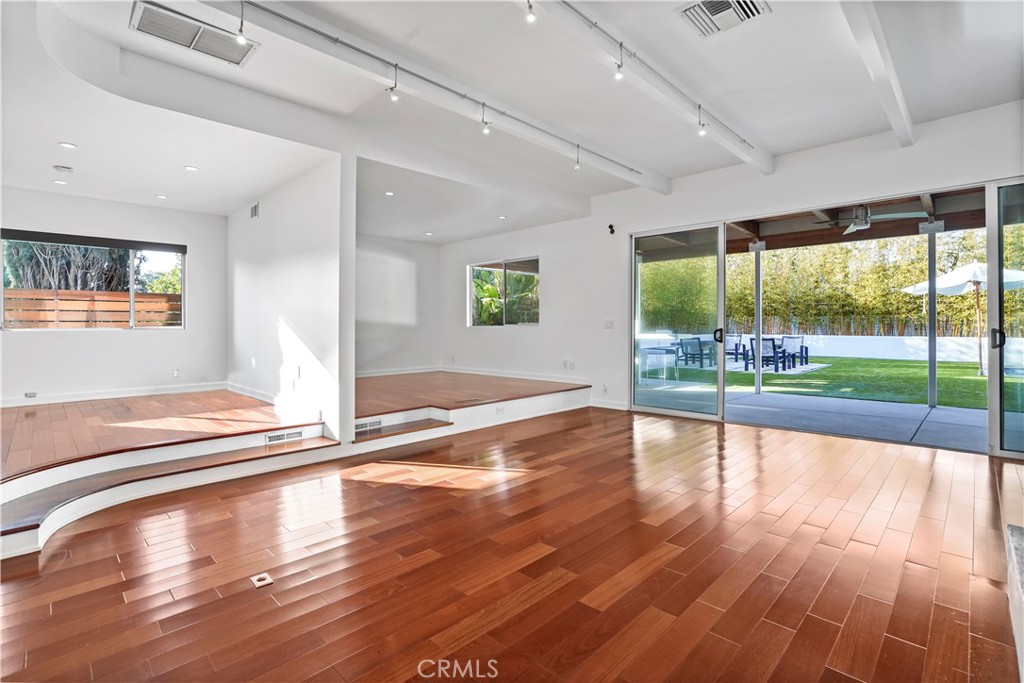 16301 Meadow Ridge Road West Encino, CA 91436 - Photo 9 of 33 a view of a living room and floor to ceiling window or wooden floor