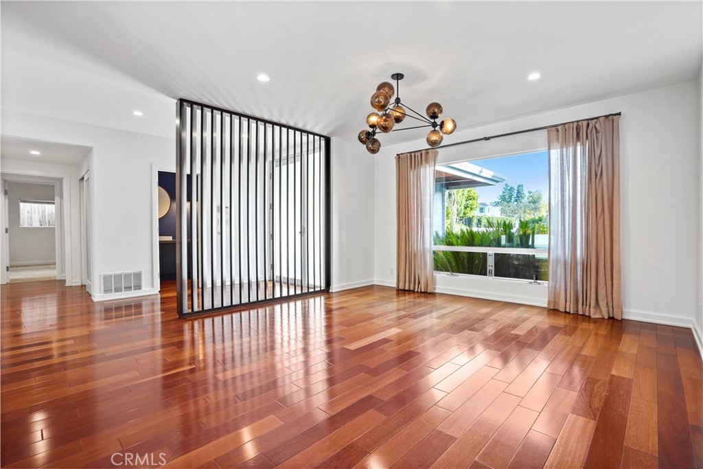 16301 Meadow Ridge Road West Encino, CA 91436 - Photo 10 of 33 a view of a room with wooden floor fan and windows