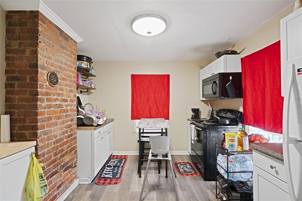 246 Colfax Street Springdale, PA 15144 - Photo 12 of 17 a view of a workspace with furniture and wooden floor