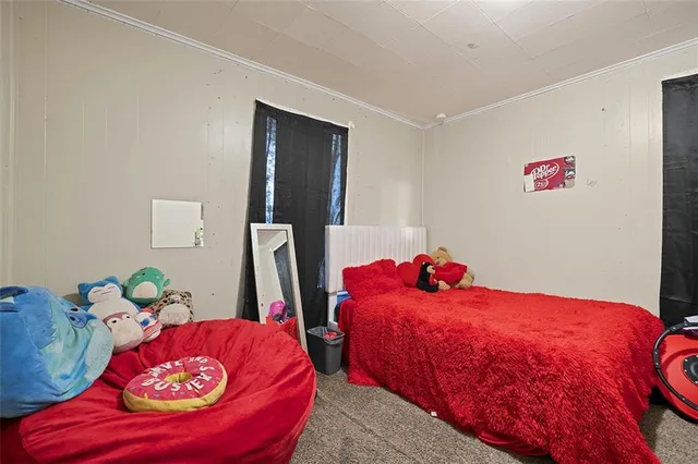 a bedroom with two beds and a couch