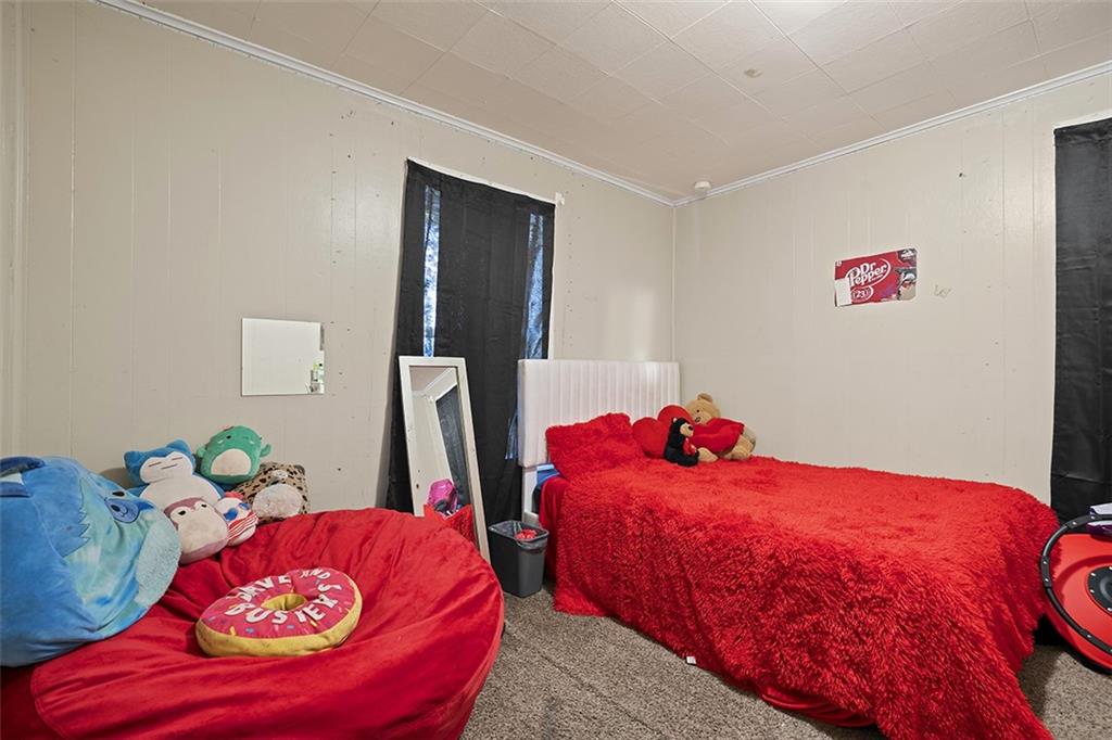 246 Colfax Street Springdale, PA 15144 - Photo 13 of 17 a bedroom with two beds and a couch