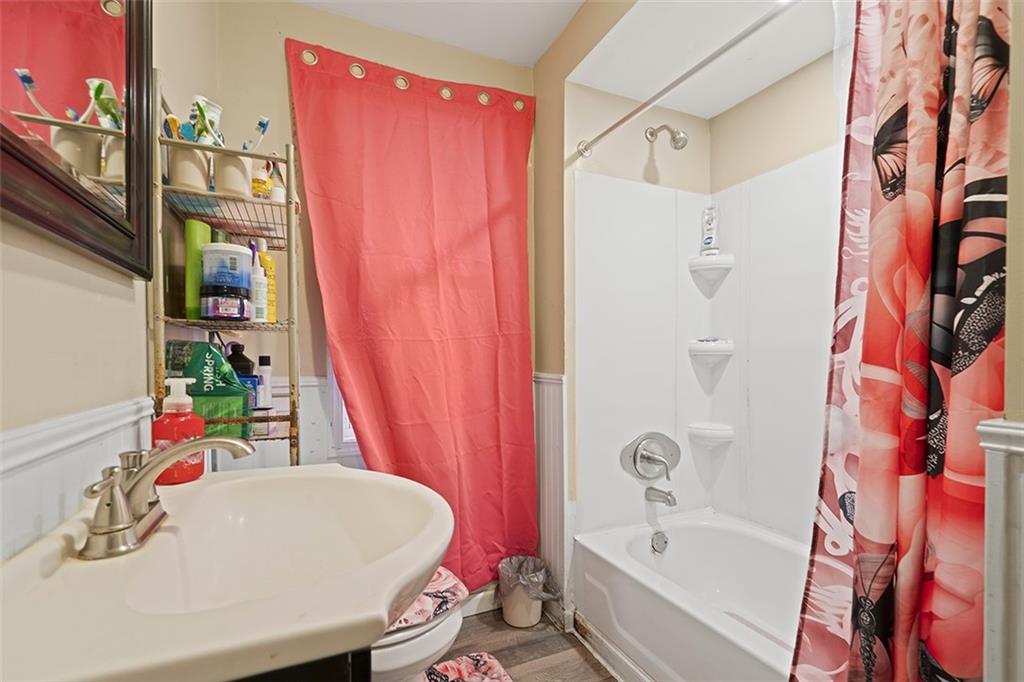 246 Colfax Street Springdale, PA 15144 - Photo 14 of 17 a bathroom with a bath tub and a sink