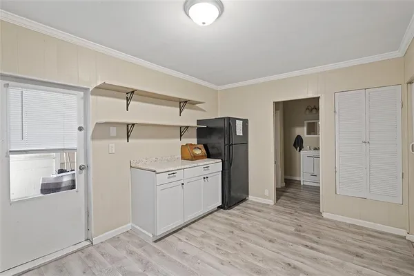 a kitchen with stainless steel appliances a refrigerator sink and cabinets