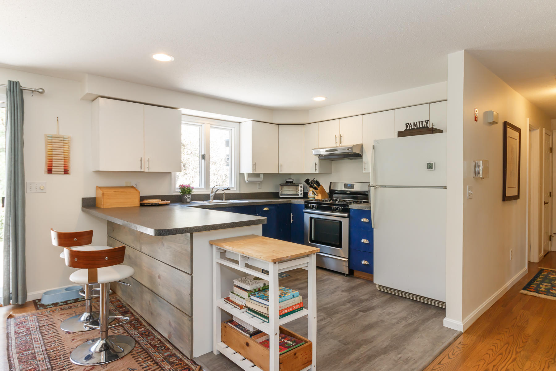 24 Green Meadow Circle Mashpee, MA 02649 - Photo 17 of 51 a kitchen with a refrigerator a sink and cabinets