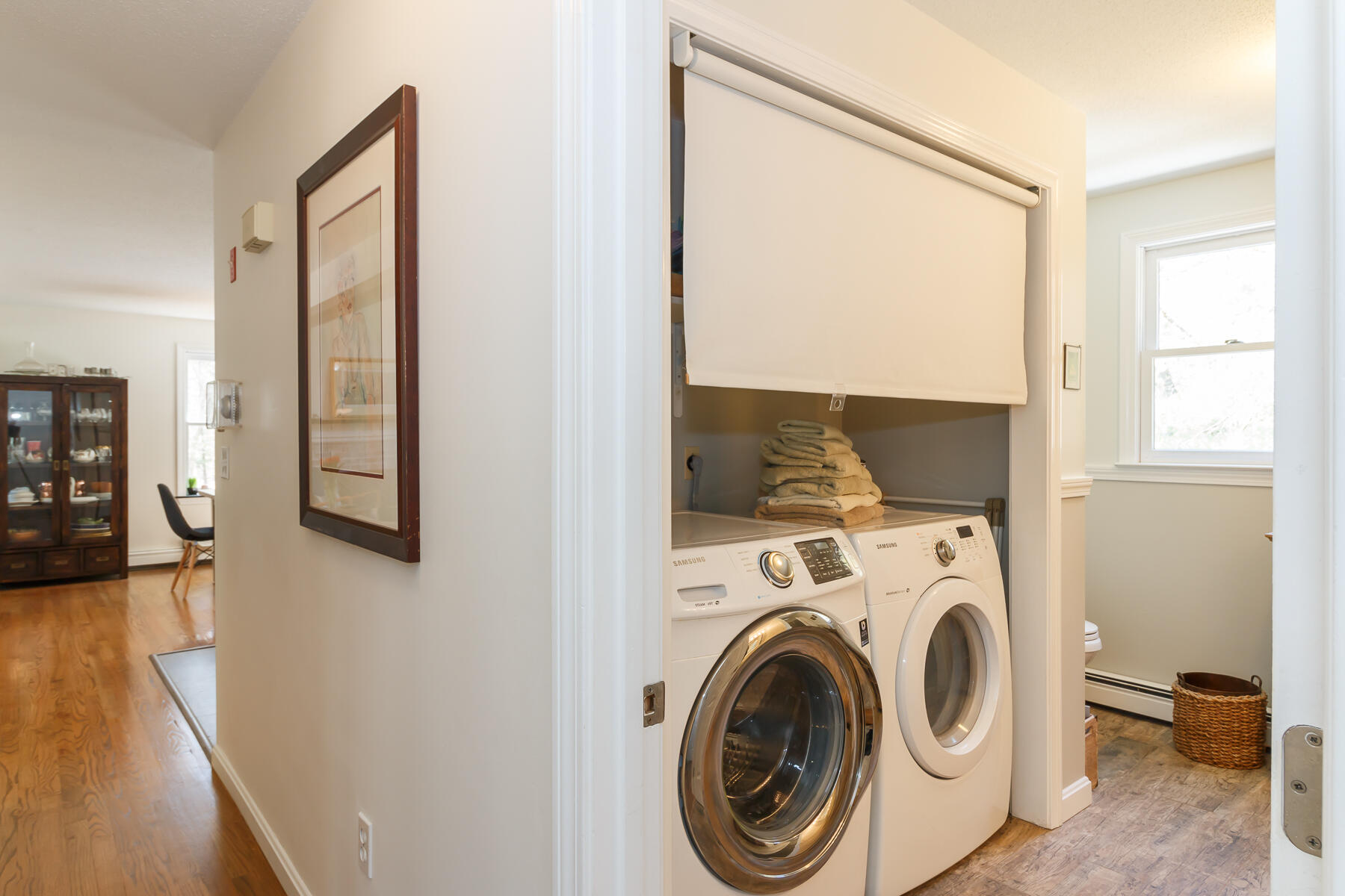 24 Green Meadow Circle Mashpee, MA 02649 - Photo 23 of 51 a view of washer and dryer with kitchen in the background