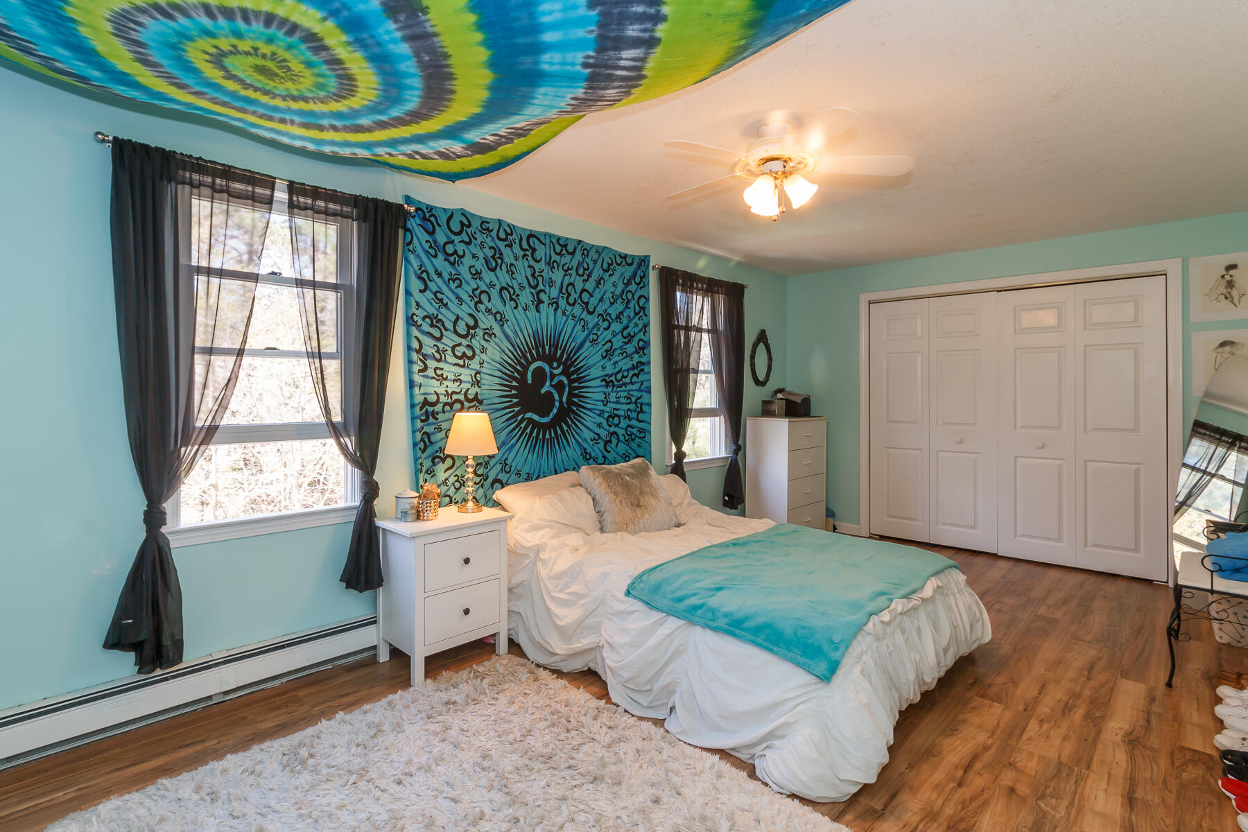 24 Green Meadow Circle Mashpee, MA 02649 - Photo 36 of 51 a living room with a bed furniture and a large window