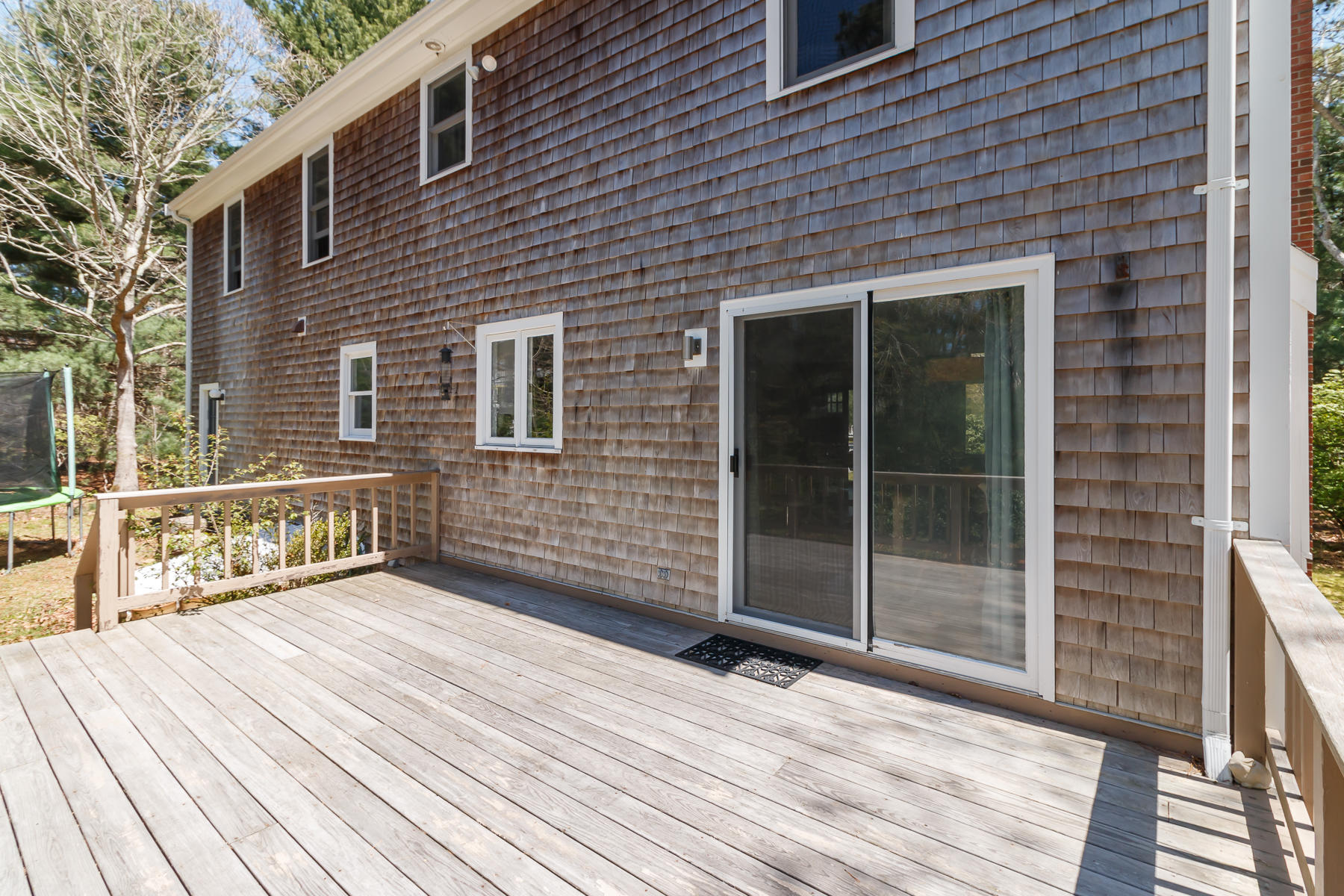 24 Green Meadow Circle Mashpee, MA 02649 - Photo 45 of 51 a view of a brick house with a large window