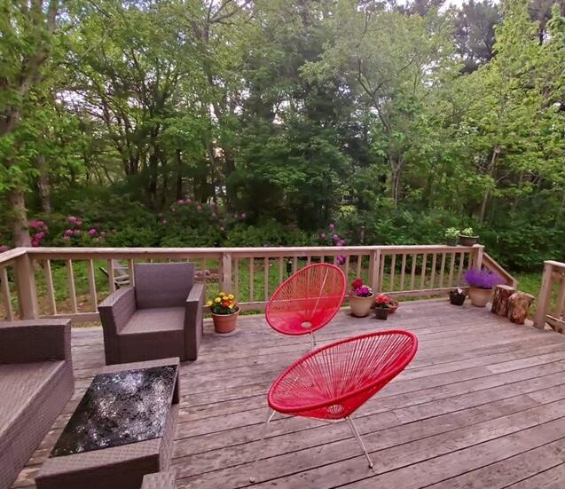 24 Green Meadow Circle Mashpee, MA 02649 - Photo 46 of 51 a balcony with wooden floor and outdoor seating